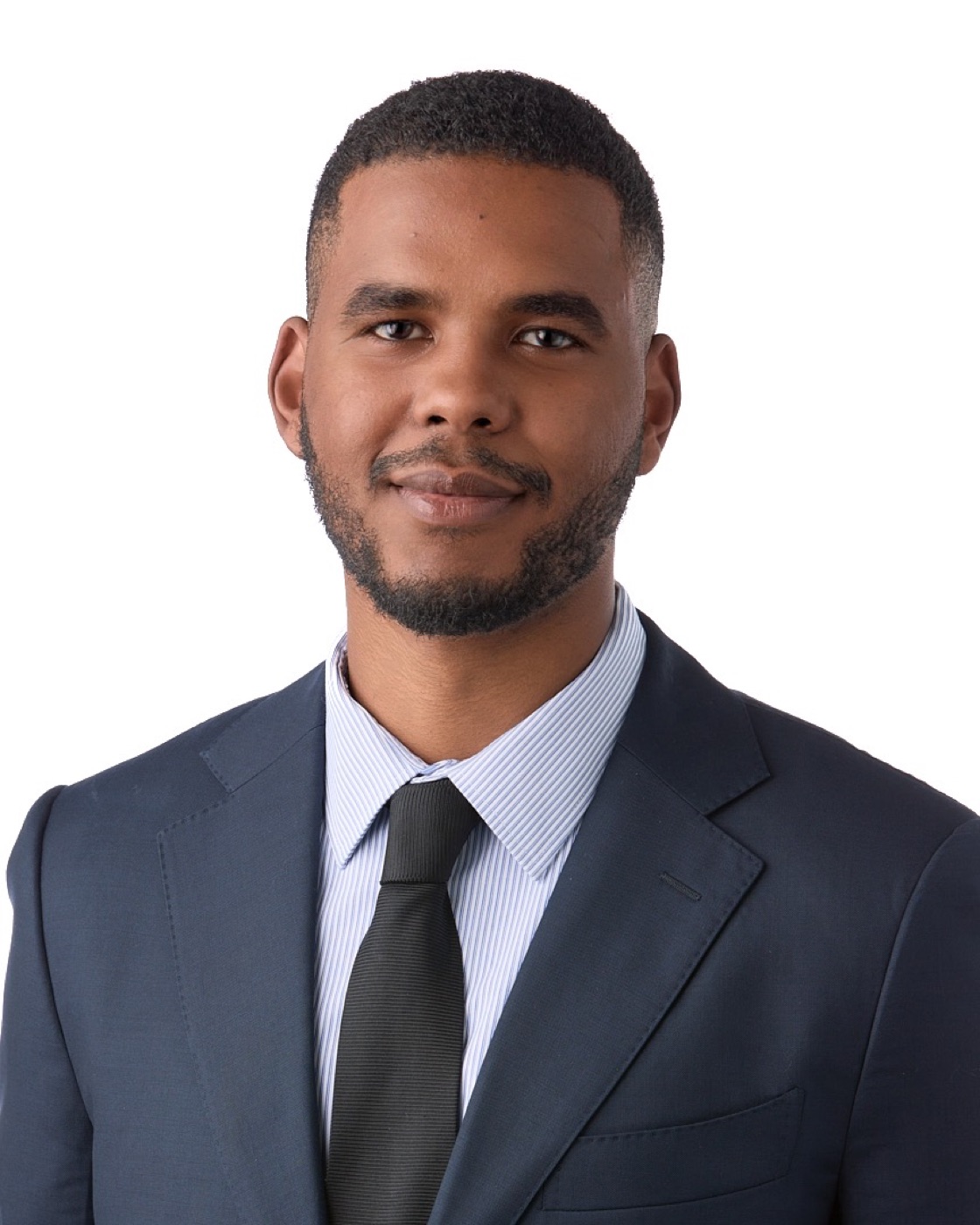 Corporate headshot of a man in a blazer, studio lighting