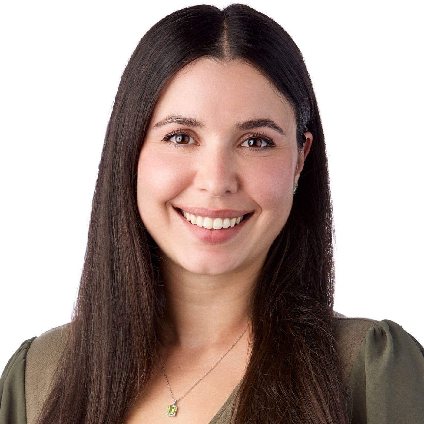 Corporate headshot of a woman in a blazer on a bright background