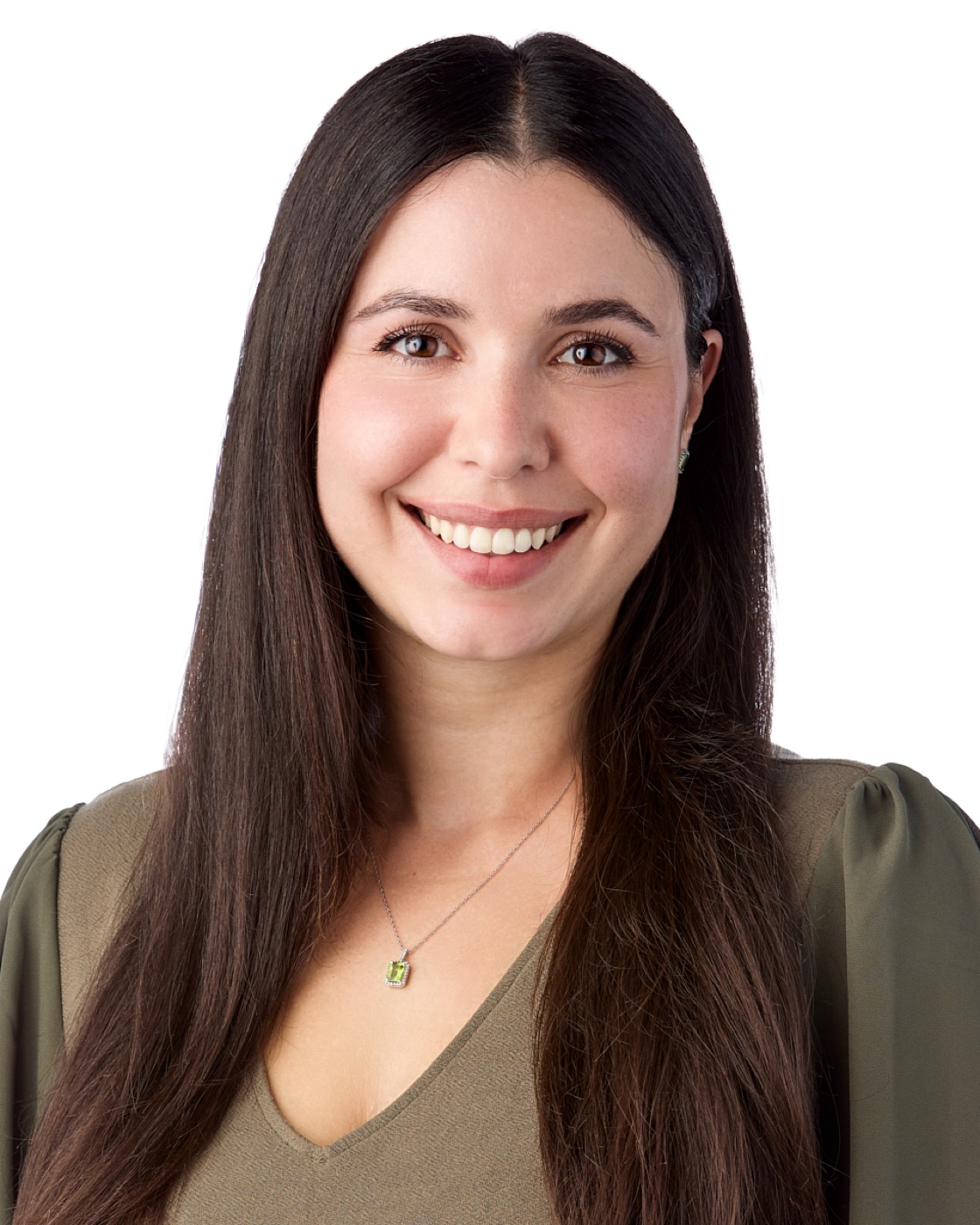 Corporate headshot of a woman in a blazer on a bright background