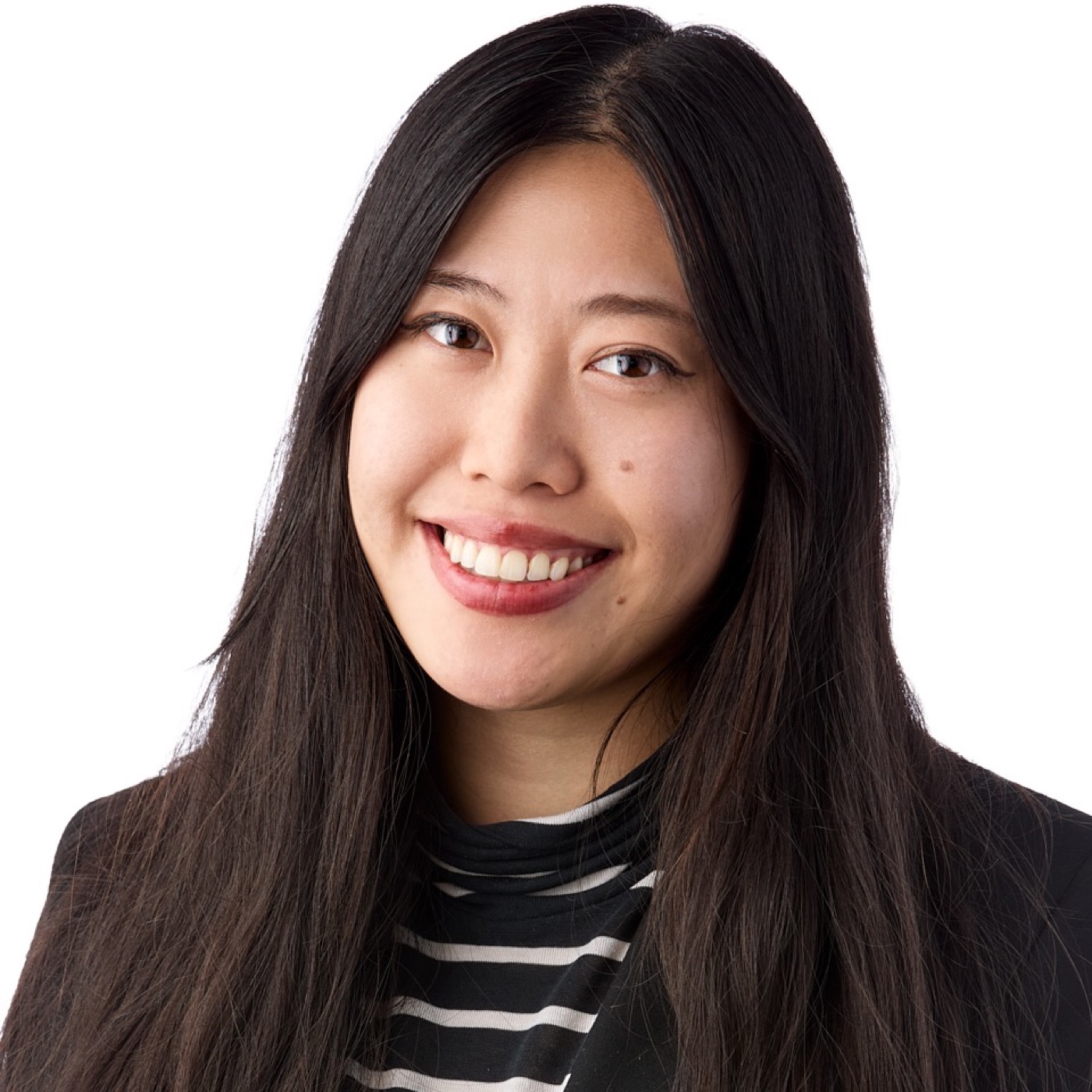 Corporate headshot of a woman smiling, studio lighting