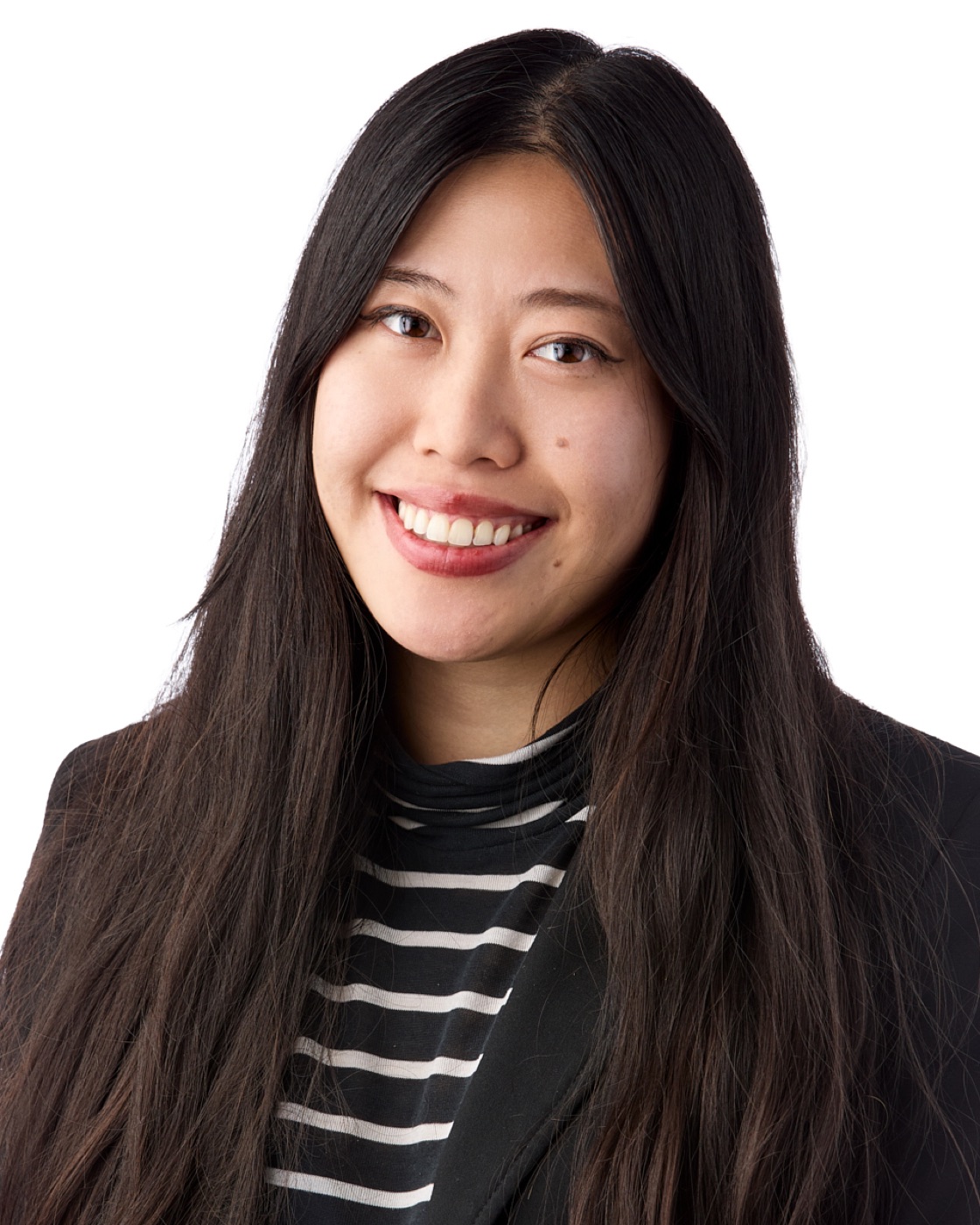Corporate headshot of a woman smiling, studio lighting